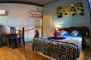 Voodi või voodid majutusasutuse Batchelor Butterfly Farm toas