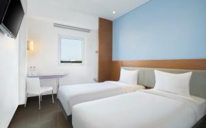 Krevet ili kreveti u jedinici u okviru objekta Amaris Hotel Madiun