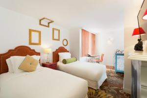 Letto o letti in una camera di The Luxe Manor