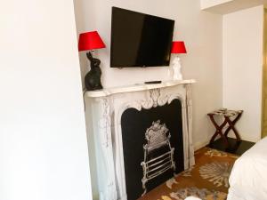 TV o dispositivi per l'intrattenimento presso The Luxe Manor