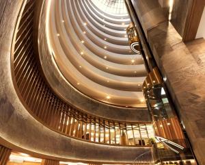a spiral staircase in a building with a ceiling at Surmeli Istanbul Hotel in Istanbul