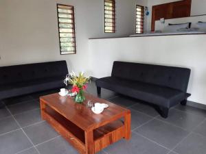 Posezení v ubytování Whispering Palms - Absolute Beachfront Villas
