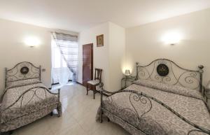 Residenza Di Via Piccardi 객실 침대