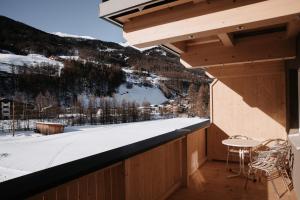 a balcony with a view of a snow covered mountain at House 55 in Sölden