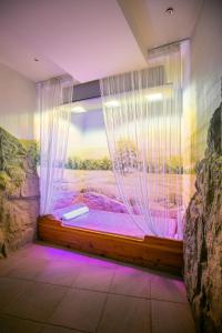 Postel nebo postele na pokoji v ubytování Trofana Wellness & SPA