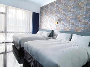 Postel nebo postele na pokoji v ubytování Champ De Rose Hotel