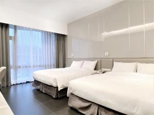 Postel nebo postele na pokoji v ubytování Champ De Rose Hotel