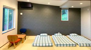 Tempat tidur dalam kamar di Koti Yamanakako next to Hananomiyako Kouen
