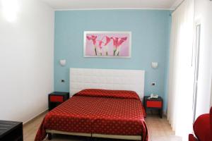 Postel nebo postele na pokoji v ubytování Hotel Vittorio Emanuele