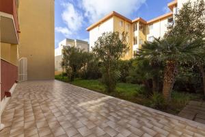 a driveway in front of a building at Red Passion Beach in Alghero