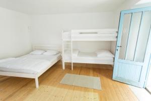 Voodi või voodid majutusasutuse Hiša Šucarija toas