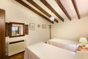 Postel nebo postele na pokoji v ubytování Villa Boquer Petit - Piedra