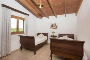 Posteľ alebo postele v izbe v ubytovaní Villa Es Jardi - Servera