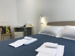 Postel nebo postele na pokoji v ubytování Affittacamere Sapore di Mare + 13 fotografií