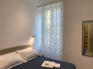Postel nebo postele na pokoji v ubytování Affittacamere Sapore di Mare