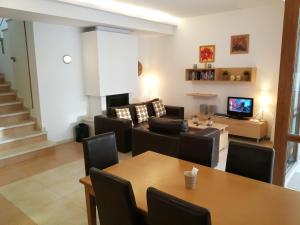 a living room with a table and a couch at Cozy family villa 500m. from the beach in Byala