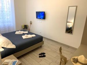 Postel nebo postele na pokoji v ubytování Affittacamere Sapore di Mare