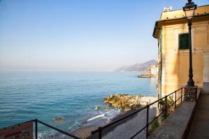 a view of the ocean from a building at Il Mare di Camogli da un oblò by Wonderful Italy in Camogli