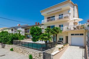 an image of a house with a garage at Abros potkrovlje in Crikvenica