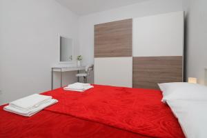 Posteľ alebo postele v izbe v ubytovaní Apartments M&P