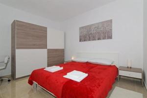Posteľ alebo postele v izbe v ubytovaní Apartments M&P