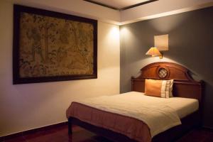Säng eller sängar i ett rum på Pecatu GuestHouse