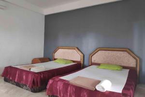 Postel nebo postele na pokoji v ubytování Pecatu GuestHouse