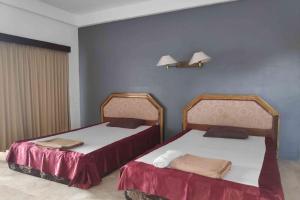 Postel nebo postele na pokoji v ubytování Pecatu GuestHouse