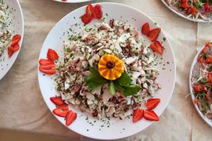 a plate of rice and strawberries on a table at Hotel La Collinetta in Torre Vado