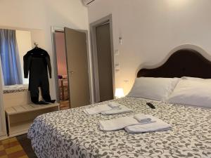 Postel nebo postele na pokoji v ubytování Affittacamere LevantoMare
