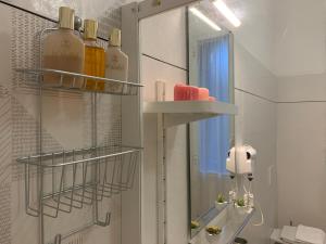 a bathroom with a mirror and a sink at Affittacamere Il Borgo in Levanto +25 photos