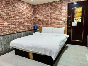 Bin Chen Business Hotelにあるベッド