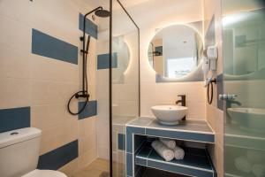 A bathroom at Faliraki Premium Hotel