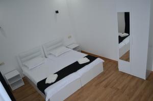 Postel nebo postele na pokoji v ubytování White Hotel