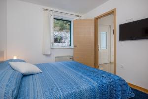 Postel nebo postele na pokoji v ubytování Villa Kogo