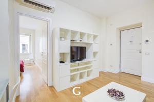 Televízia a/alebo spoločenská miestnosť v ubytovaní Residenza Gonfalone