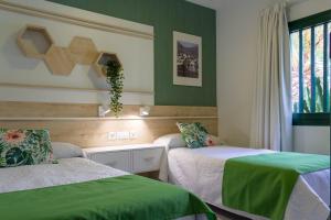 Postel nebo postele na pokoji v ubytování Apartamentos La Tegala