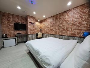 Bin Chen Business Hotelにあるベッド