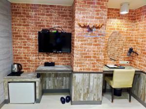 Bin Chen Business Hotelにあるテレビまたはエンターテインメントセンター