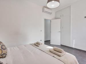 Łóżko lub łóżka w pokoju w obiekcie Sur Suites El Carmen