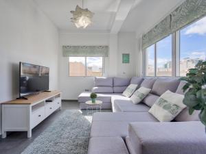 Telewizja i/lub zestaw kina domowego w obiekcie Sur Suites El Carmen