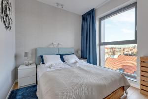 Postel nebo postele na pokoji v ubytování Comfort Apartments Granaria