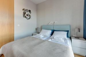 Postel nebo postele na pokoji v ubytování Comfort Apartments Granaria