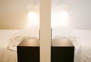 Postel nebo postele na pokoji v ubytování Arena Zone Hotel