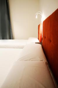 Postel nebo postele na pokoji v ubytování Arena Zone Hotel