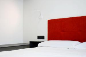 Postel nebo postele na pokoji v ubytování Arena Zone Hotel