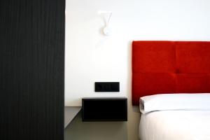 Postel nebo postele na pokoji v ubytování Arena Zone Hotel
