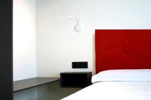 Postel nebo postele na pokoji v ubytování Arena Zone Hotel