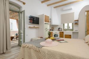 a room with a table with a hat on it at Aegean White Home in Naxos Chora