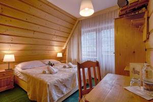 Posteľ alebo postele v izbe v ubytovaní Góralski Gościniec & SPA